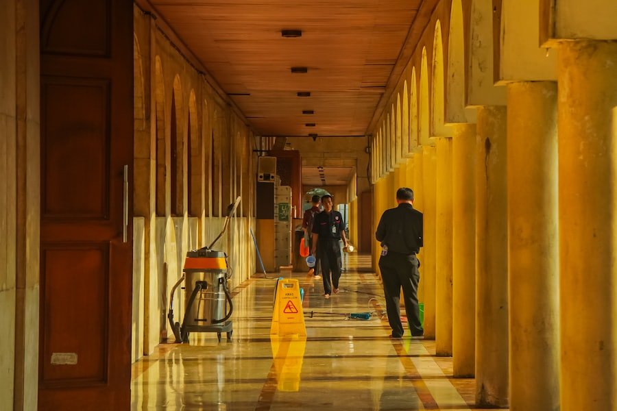 Housekeeping team working in a residential building corridor